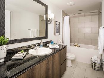 Large soaking tub in master bathroom with a tile surround